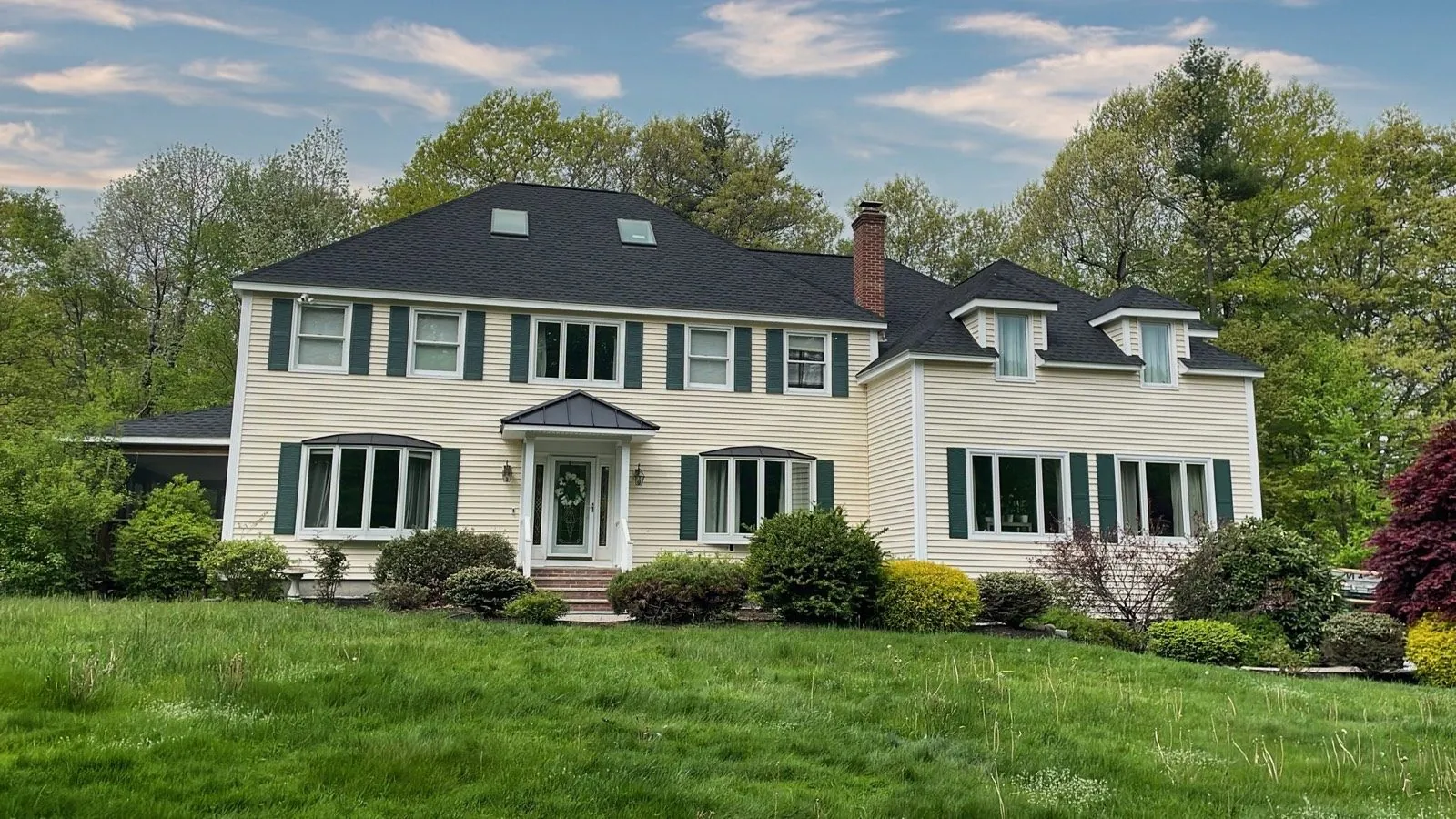 Colonial home with a new architectural shingle roof