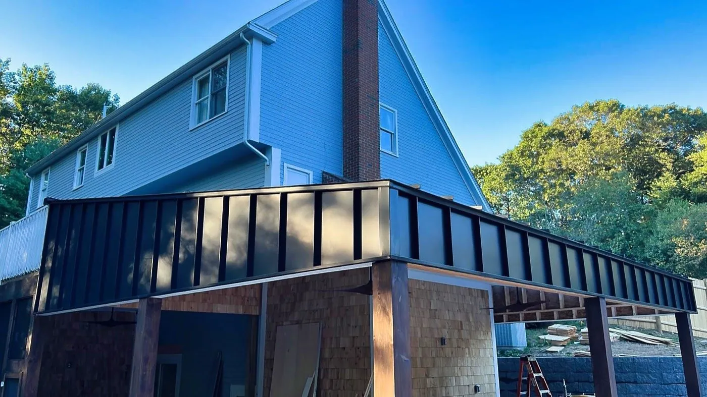 Blue standing seam on a gable addition